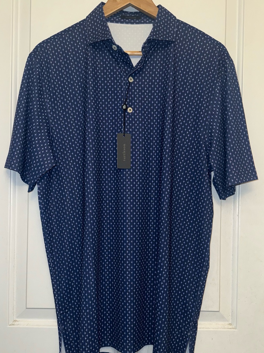 Turtleson NWT “Archer” Performance Polo in Navy/White Starburst Print